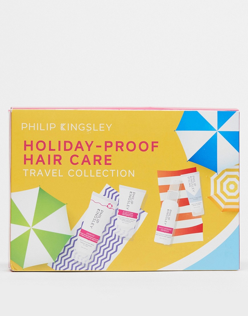 Brightly colored box featuring the "Phillip Kingsley Holiday Proof Hair Collection," with a yellow background, colorful umbrellas, and travel-sized hair care products displayed.