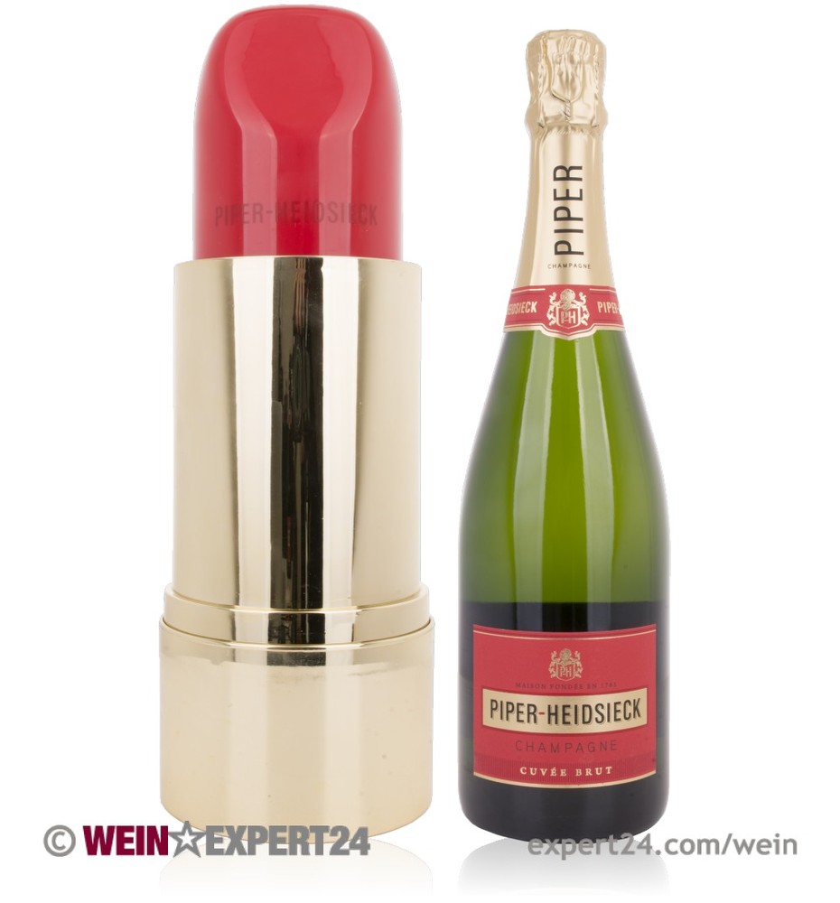 Red lipstick-shaped container beside a bottle of Piper-Heidsieck Cuvée Brut Champagne, featuring a gold base and red accents, presented in a limited edition gift pack.