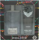 Clear rectangular bottle of Police Original EDT with a grey cap, alongside a matching black shower gel tube, both displayed in a colorful, patterned box.