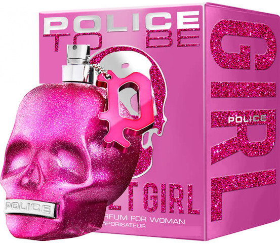 Bright pink skull-shaped bottle with glitter finish, silver cap, and a charm featuring the letter "P," alongside a matching pink box with sparkling text.