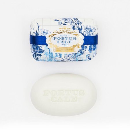 Elegant gold and blue floral-patterned packaging surrounds a smooth, oval white bar of soap embossed with "PORTUS CALE," showcasing its luxurious design.
