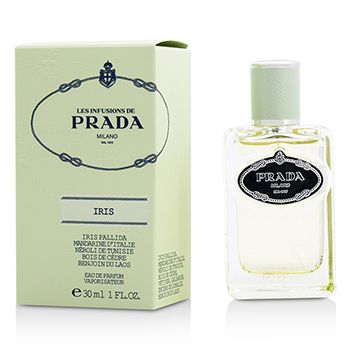Clear glass bottle of Prada Infusion D'Iris Eau De Parfum with a black label, accompanied by a light green box featuring elegant black and white detailing, both labeled "Iris."