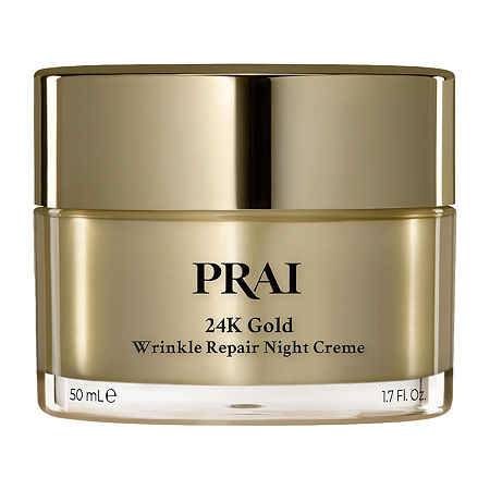Gold-colored jar with a shiny lid, labeled "PRAI 24K Gold Wrinkle Repair Night Creme," containing 50ml of cream, emphasizing luxury and anti-aging benefits.