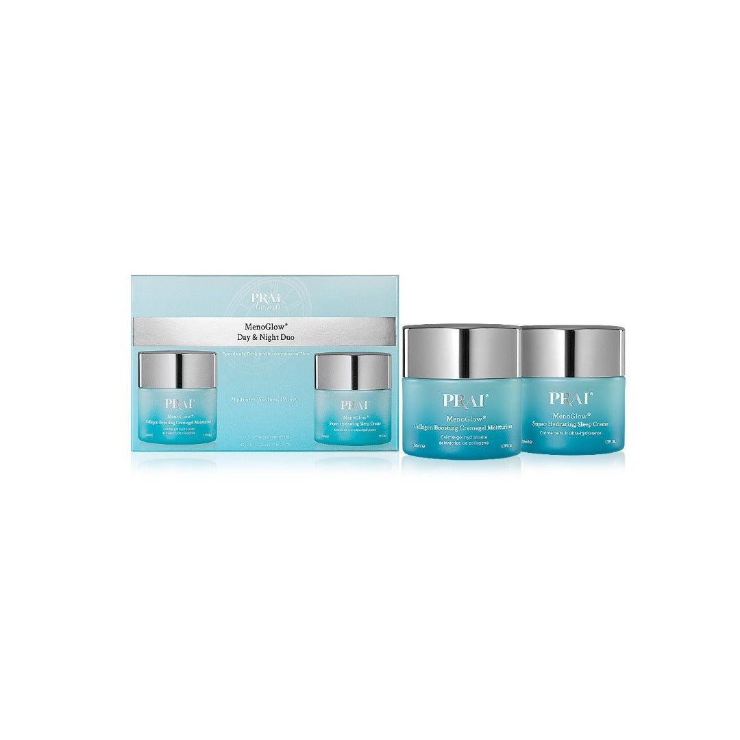 Two 50ml jars of PRAIBeauty MenoGlow Day & Night Duo in sleek glass containers with silver lids, presented in a matching blue and white box.