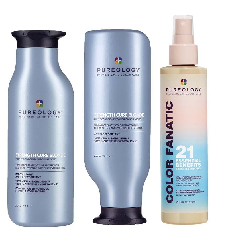 Three hair care products from Pureology: a dark purple shampoo bottle, a matching conditioner bottle, and a light spray bottle labeled "Color Fanatic" in a clear design.