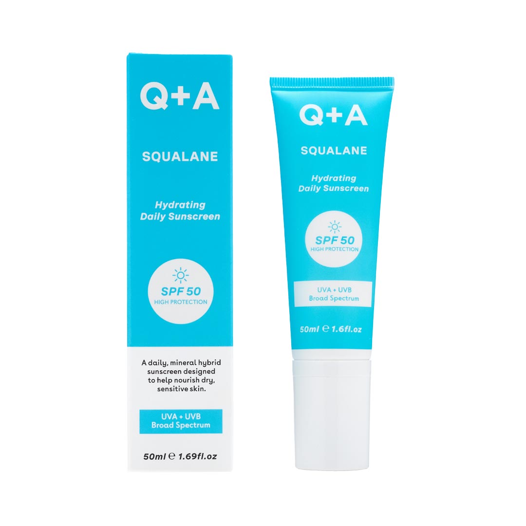 Light blue tube with white text, labeled "Q+A Squalane Hydrating Daily Sunscreen SPF 50," alongside a matching box, emphasizing hydration and sun protection for sensitive skin.