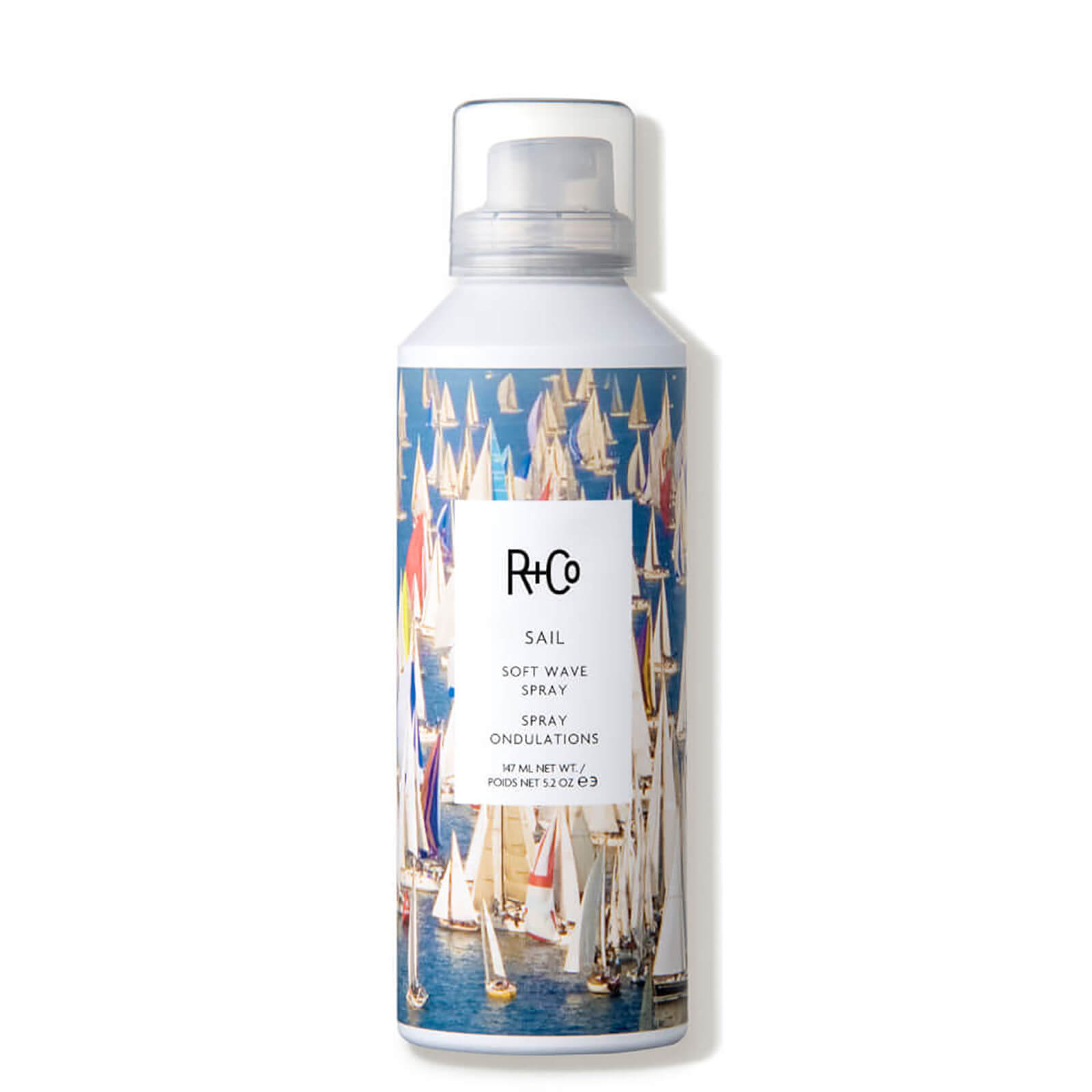 R+Co Sail Soft Wave Spray in a 5.2 oz bottle features a colorful sailboat design on a white background, with a clear spray nozzle at the top.