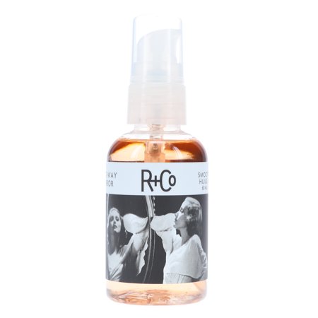 R+Co Two Way Mirror Smoothing Oil in a clear 60ml bottle, featuring a black and white label with images of two women, designed for heat protection and suitable for all hair types.