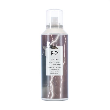 R+Co Zig Zag Root Teasing + Texture Spray in a sleek metallic can with a lightning design, featuring a white label with black text, 177ml size for all-day volume hold.
