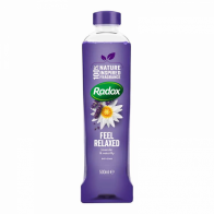 Purple plastic bottle of Radox Mineral Therapy Bath Soak labeled "Feel Relaxed," featuring a flower design and a green logo, with a capacity of 500 ml.