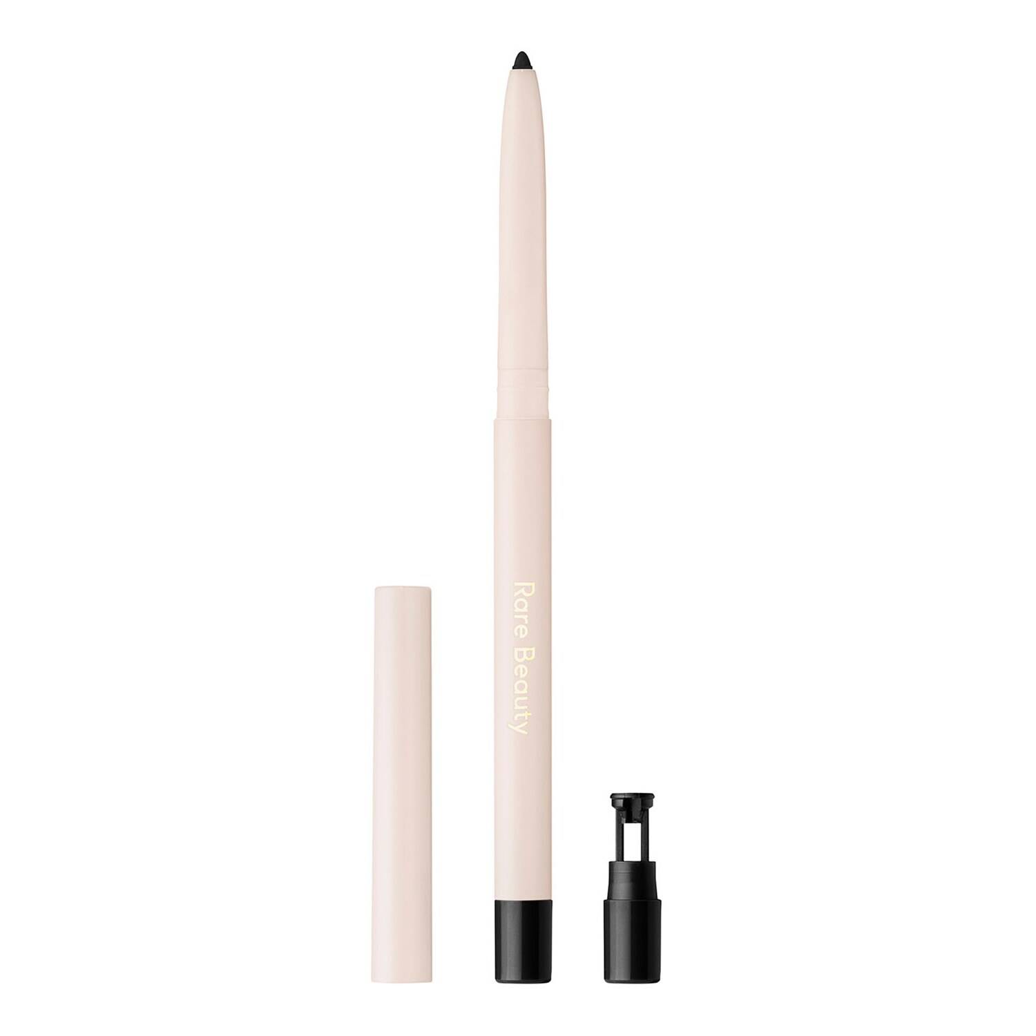 Light pink gel eyeliner pencil with a black tip and a removable cap, featuring "Rare Beauty" branding in gold on the side, labeled as "Compassion."
