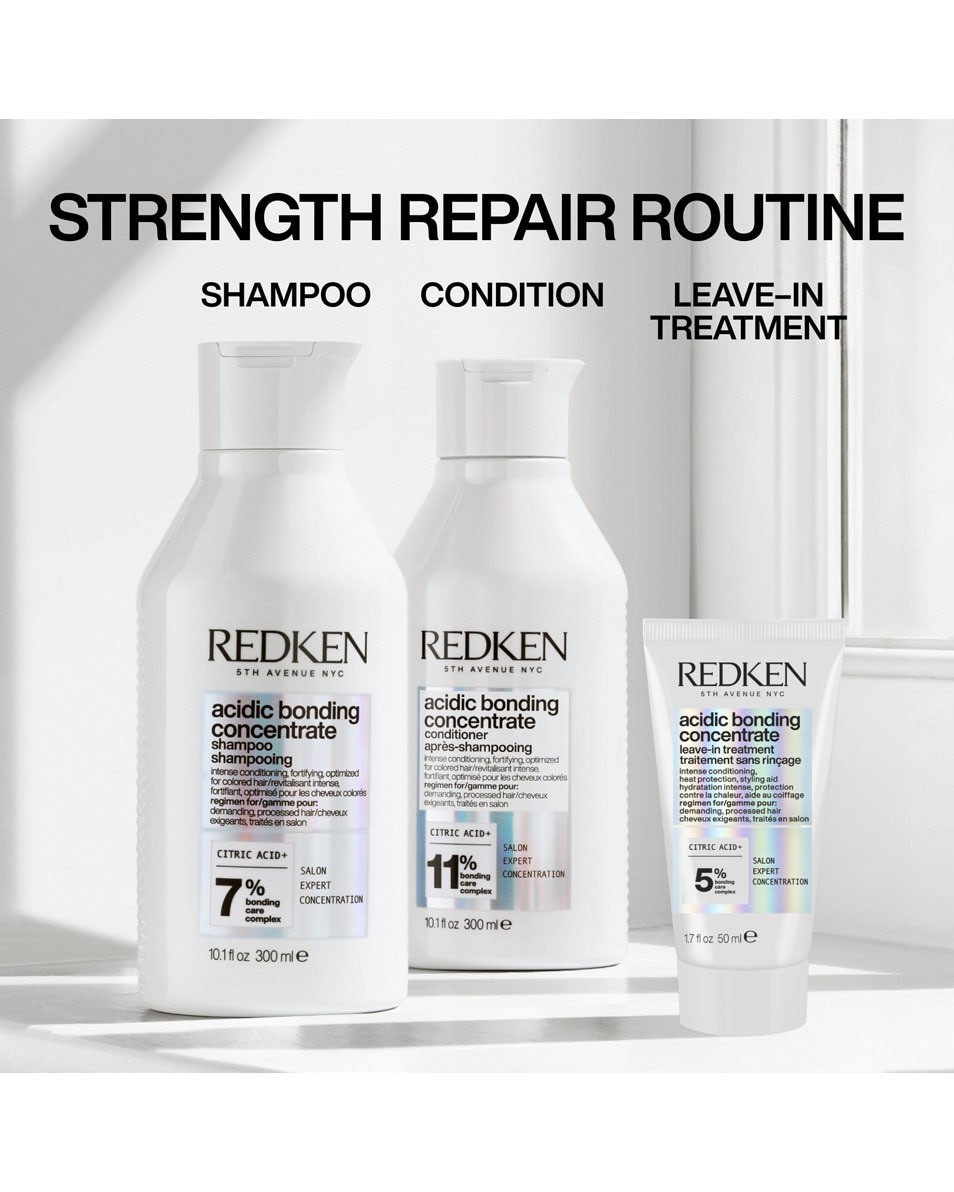 Redken Acidic Bonding Concentrate Leave-in Care in a 50 ml white tube, featuring a sleek design with black text and a silver cap, promoting strengthening hair treatment.