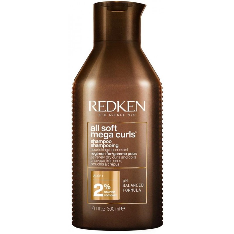 Redken All Soft Mega Curls Shampoo in a brown bottle, featuring a curved design, gold accents, and a label highlighting its nourishing formula for curly hair.
