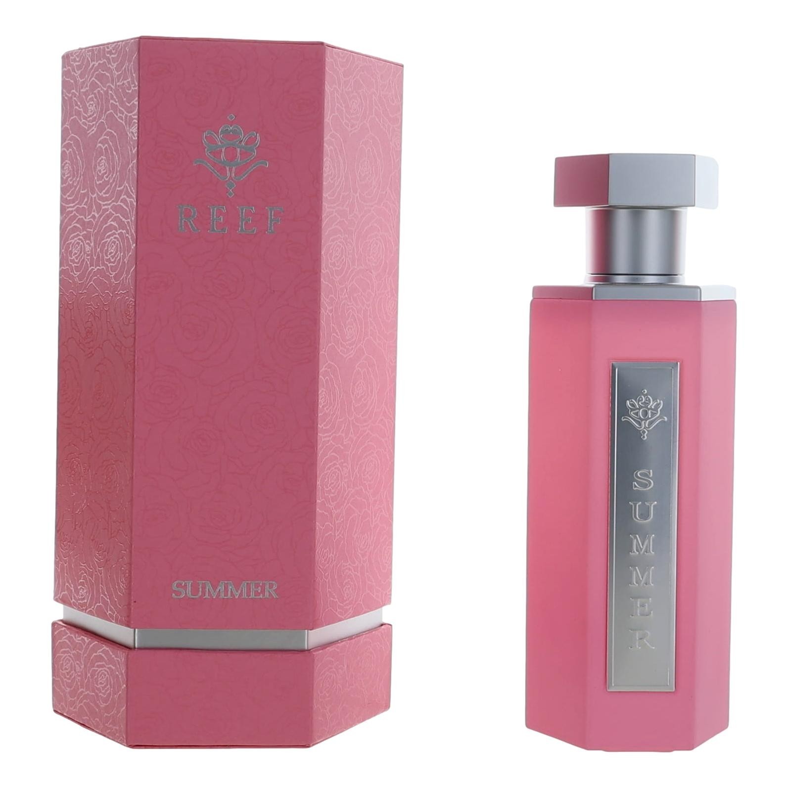 Pink rectangular bottle with a silver cap, featuring "SUMMER" engraved on a silver plate, alongside a matching pink box with a floral design and "REEF" branding.