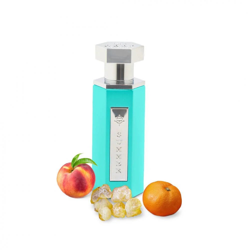 Turquoise glass perfume bottle with a silver cap, labeled "SUMMER," accompanied by a peach, orange, and yellow resin pieces, representing the Tiffany Summer Collection EDP for women.