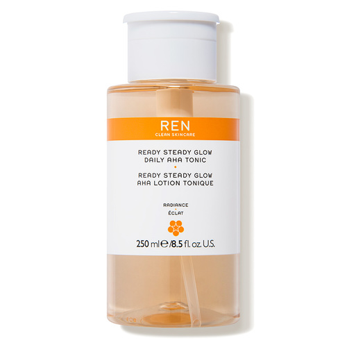 Clear plastic bottle of REN Ready Steady Glow Tonic, 250ml, featuring an orange and white label with text highlighting its AHA formula for radiance.