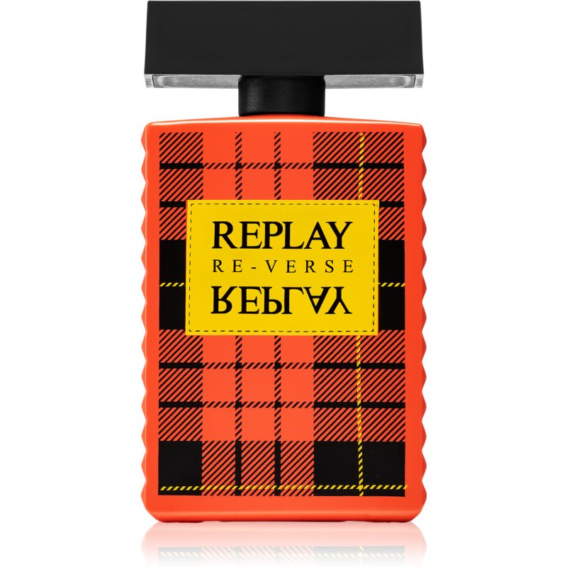 Bright orange bottle with a textured surface, featuring a black cap and a yellow label with black lettering in a plaid pattern, labeled "REPLAY RE-VERSE."