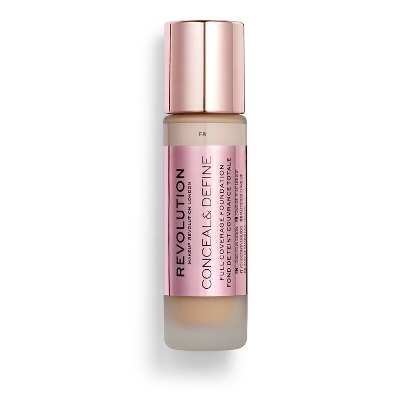 Makeup Revolution Conceal & Define Foundation in shade F8, featuring a frosted glass bottle with a rose gold cap and a pink label detailing the product name.