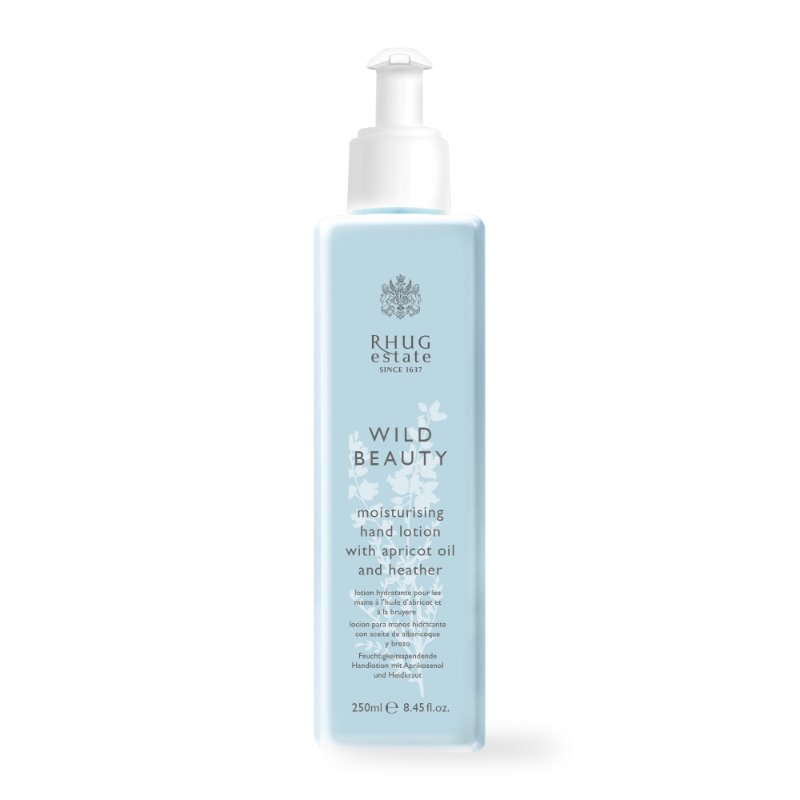 Light blue bottle of Rhug Wild Beauty Moisturising Hand Lotion, featuring apricot oil and heather, with a white pump dispenser and elegant branding on the front.