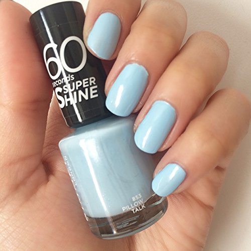Light blue nail polish in a glass bottle with a black cap, labeled "60 Seconds Super Shine" and "Shade 853 Pillow Talk," held in a hand with manicured nails.