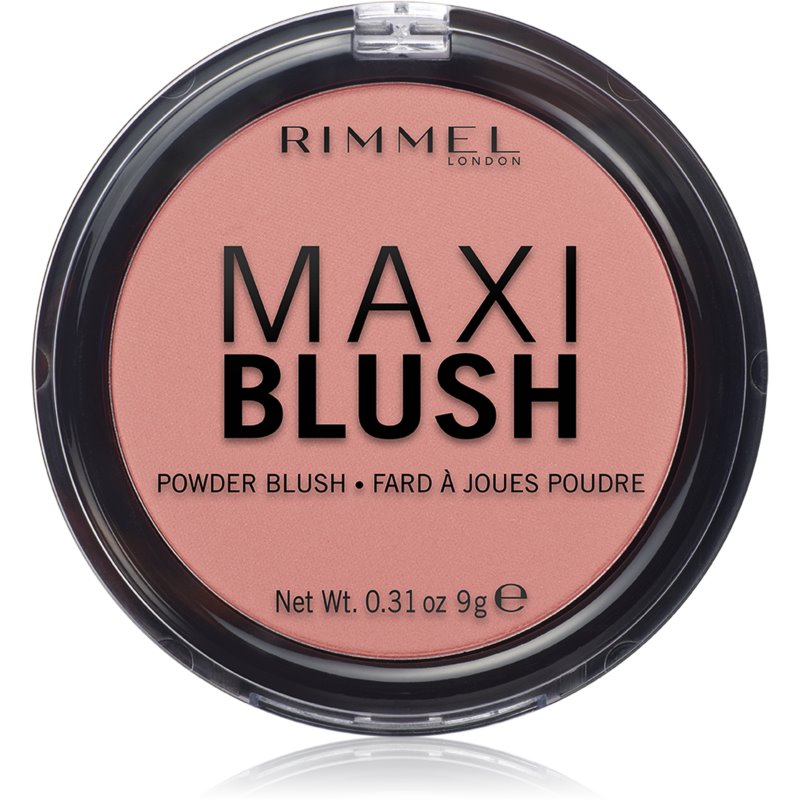 Round compact containing Rimmel's Maxi Blush Powder in Exposed, featuring a soft peachy-pink shade with bold black lettering on a clear plastic case.