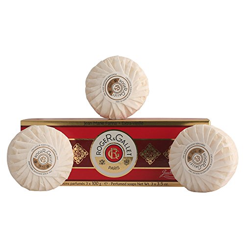Three round, white perfumed soaps wrapped in pleated paper, displayed above a red and gold box labeled "Roger Gallet Jean Marie Farina," containing three 100g bars.