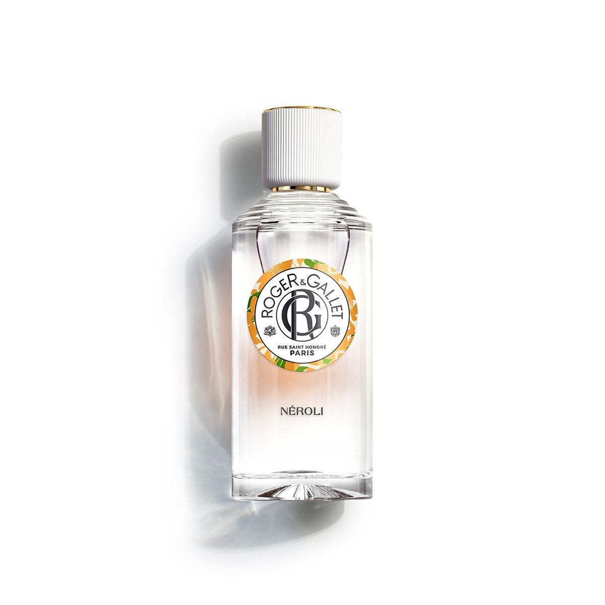 Clear glass bottle with a gold and white cap, featuring a circular label with the Roger & Gallet logo and "NÉROLI" text, containing 100ml of fragrant wellbeing water.