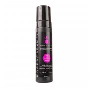 Debenhams Intensity Bronzed Tanning Foam in Ultra Dark, 200ml, features a sleek black bottle with a pump dispenser and vibrant pink accents on the label.