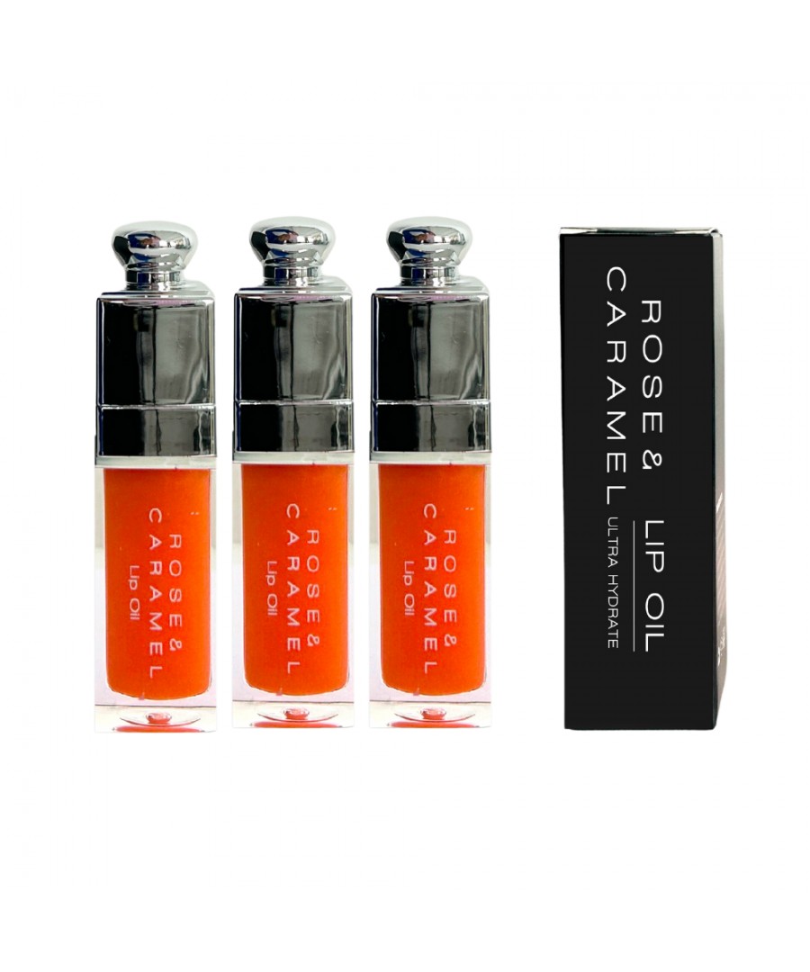 Three clear lip oil tubes with a vibrant orange tint, featuring sleek silver caps, alongside a black box labeled "Rose & Caramel Passionfruit Lip Oil."
