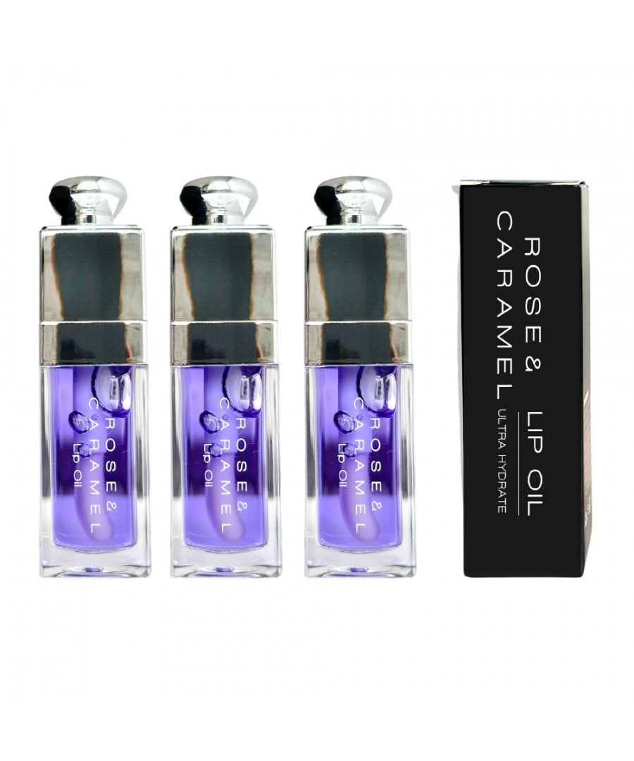 Three clear glass lip oil bottles with a lavender tint, featuring a silver cap and a black box labeled "Rose & Caramel Lip Oil" in white text.