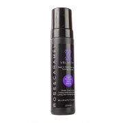 Debenhams Velvety Olive Tanning Foam in Ultra Dark, 200ml, features a sleek black bottle with a purple label and white text, showcasing its luxurious tanning formula.
