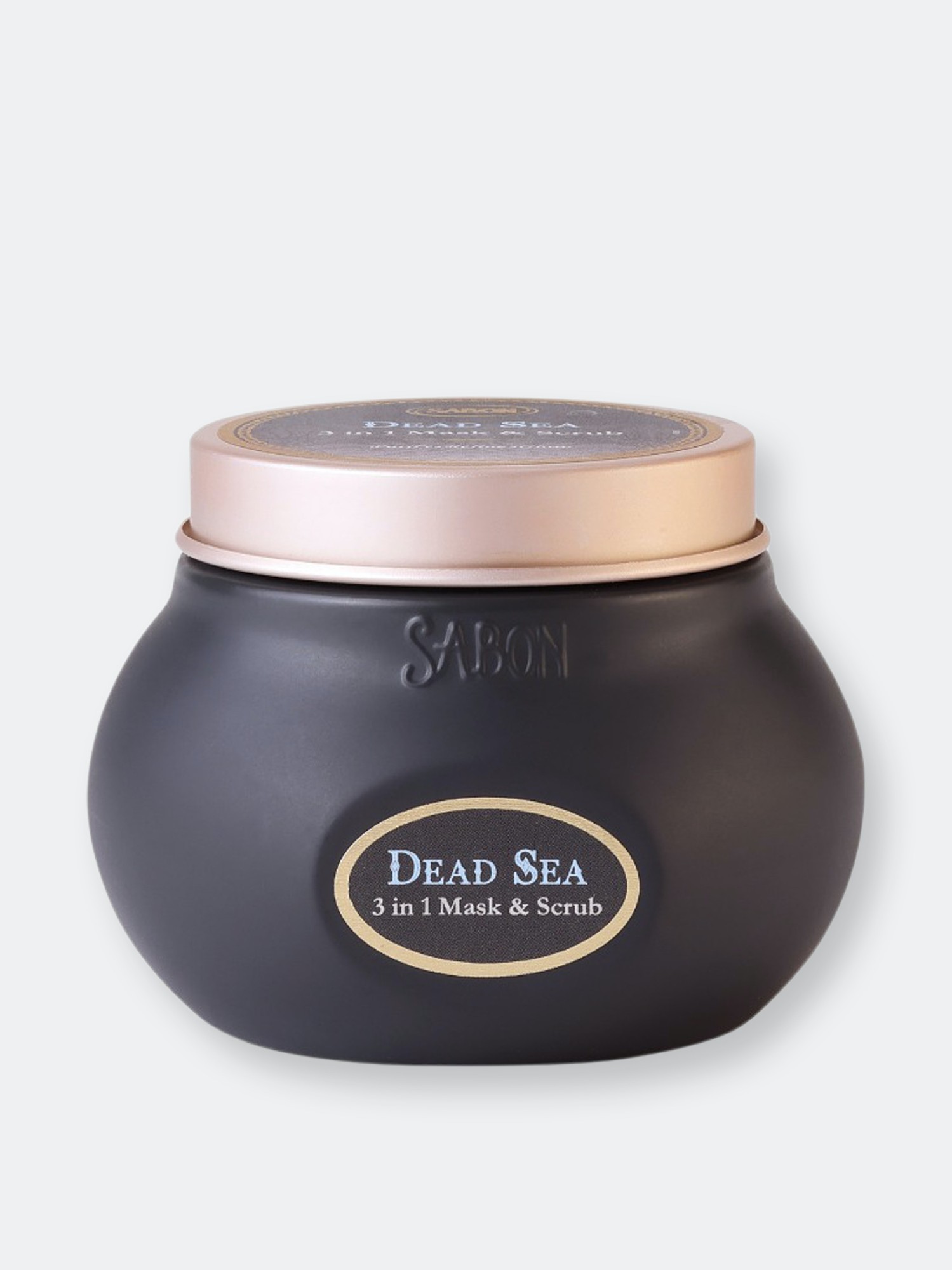 Black jar with a gold lid, labeled "DEAD SEA 3 in 1 Mask & Scrub" by Sabon, features a smooth, rounded design and elegant branding.