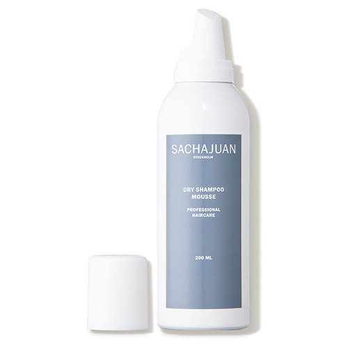 White cylindrical bottle with a gray label reading "SACHAJUAN DRY SHAMPOO MOUSSE," featuring a pump dispenser and a removable white cap.