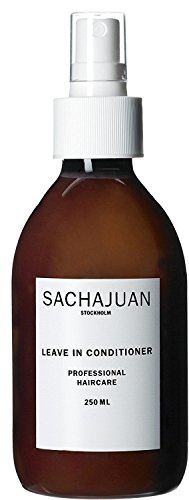 Brown glass bottle with a white spray nozzle, labeled "SACHAJUAN LEAVE IN CONDITIONER" and "250 ML," featuring a minimalist design.