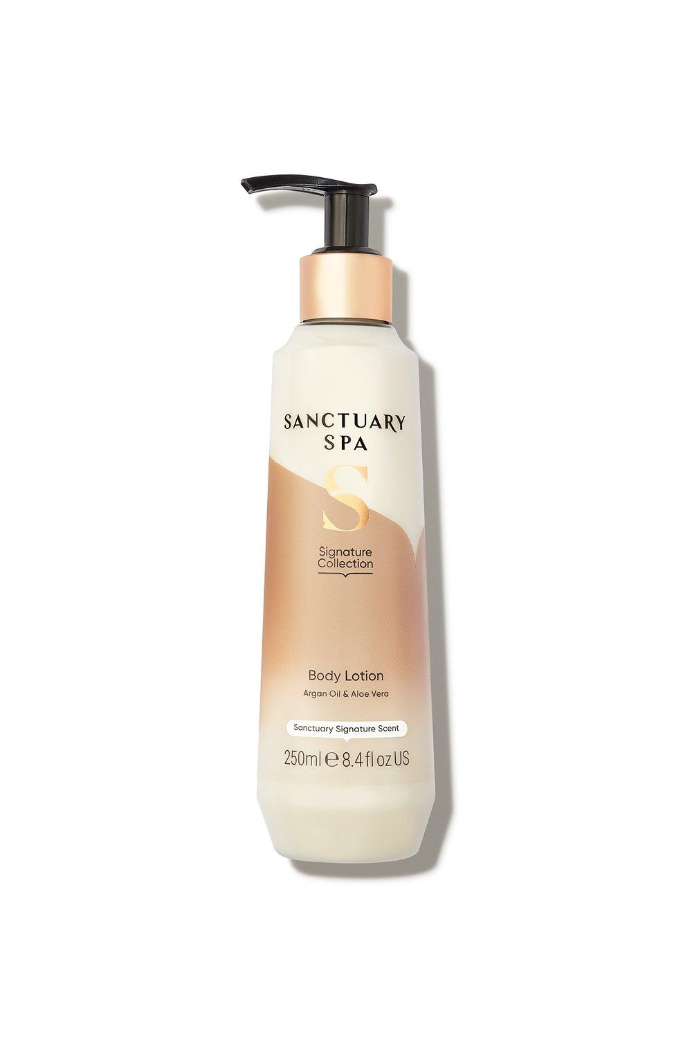 Moisturizing body milk in a sleek, cream-colored bottle with a black pump, featuring a gold and white label that highlights "Sanctuary Spa" and "Aloe Vera."