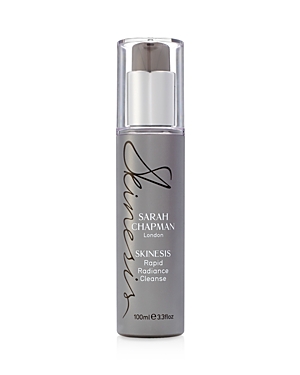 Gray bottle with a sleek design, featuring a silver pump top and black script labeling "Sarah Chapman Skinesis Rapid Radiance Cleanse" in elegant font, 100ml size.