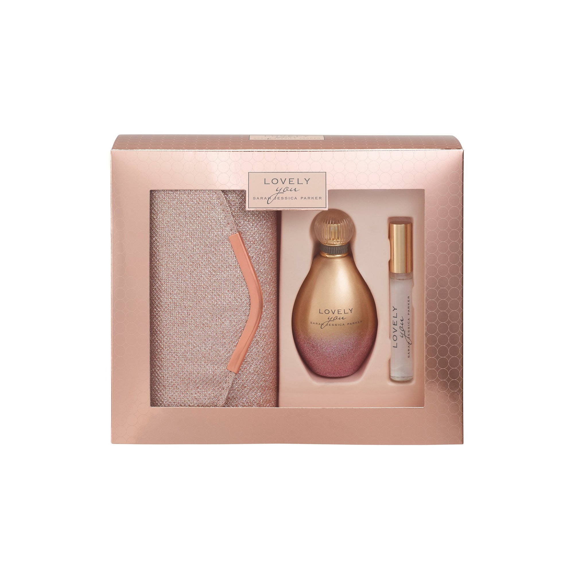 Elegant pink gift box containing a 100ml Eau De Parfum bottle, a travel-sized spray, and a soft pouch, all featuring gold accents and a stylish design.