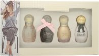 Gift set featuring four 5ml perfume bottles in elegant, rounded designs with gold caps; includes Born Lovely, Lovely, Lovely You, and Lovely Lights, all presented in a stylish cream box.