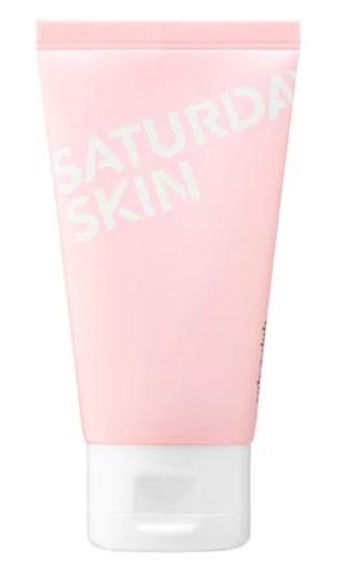 Light pink tube of Saturday Skin Rub-a-Dub Refining Peel Gel, featuring white text and a flip-top cap, designed for facial cleansing with natural fruit enzymes.