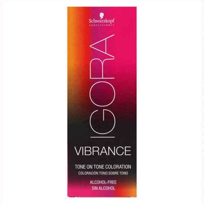 Schwarzkopf Professional Igora Vibrance semi-permanent dye in a 60ml tube, featuring a vibrant pink and black packaging, labeled as medium beige blonde, ammonia-free and alcohol-free.