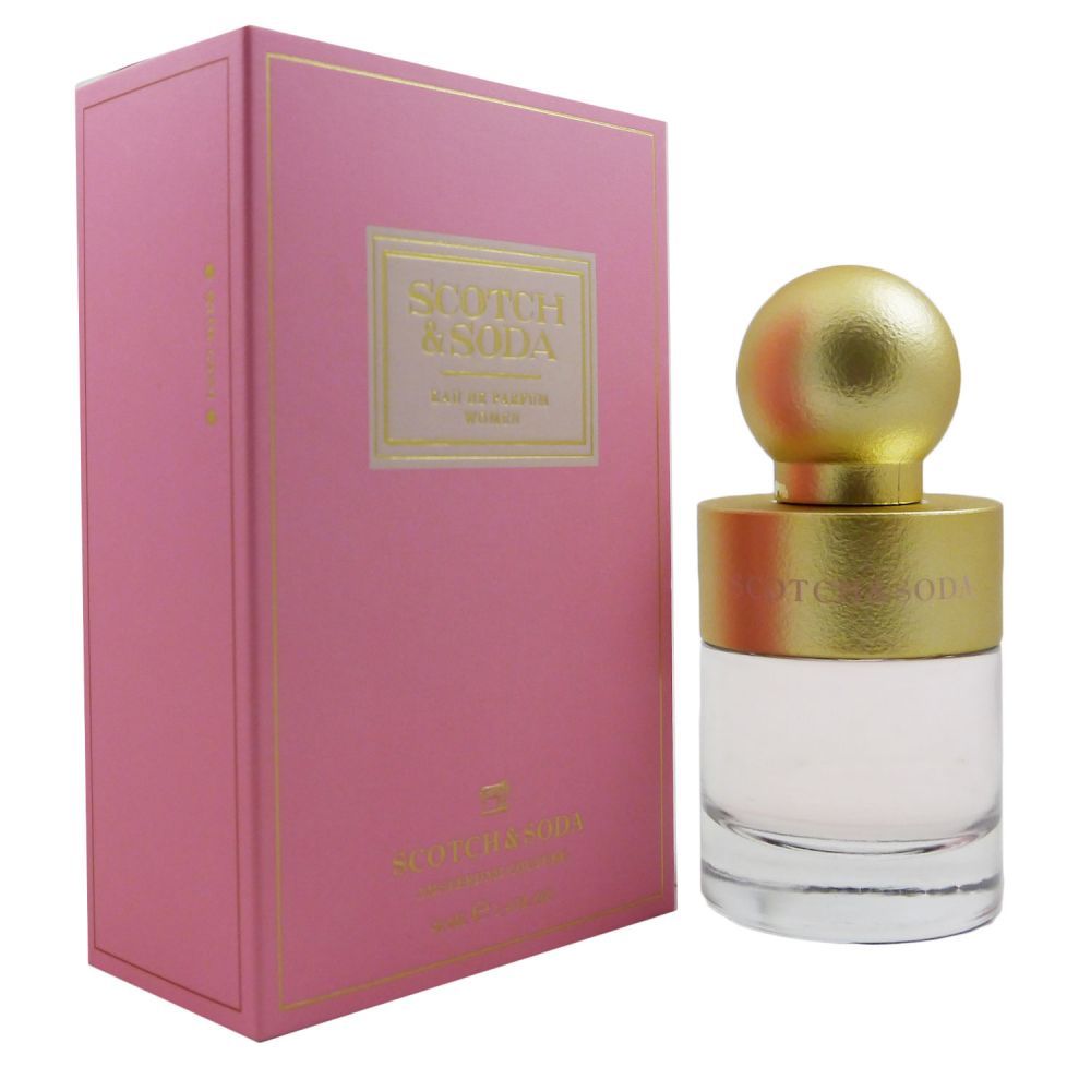 A pink box with gold lettering surrounds a clear glass perfume bottle topped with a round gold cap, labeled "Scotch & Soda EAU DE PARFUM SPRAY 1.4 OZ for WOMEN."