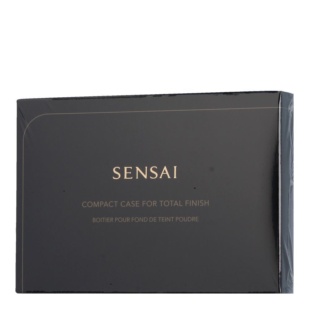 Black compact case with a sleek design, featuring gold lettering that reads "SENSAI" and "COMPACT CASE FOR TOTAL FINISH," ideal for holding foundation powder.