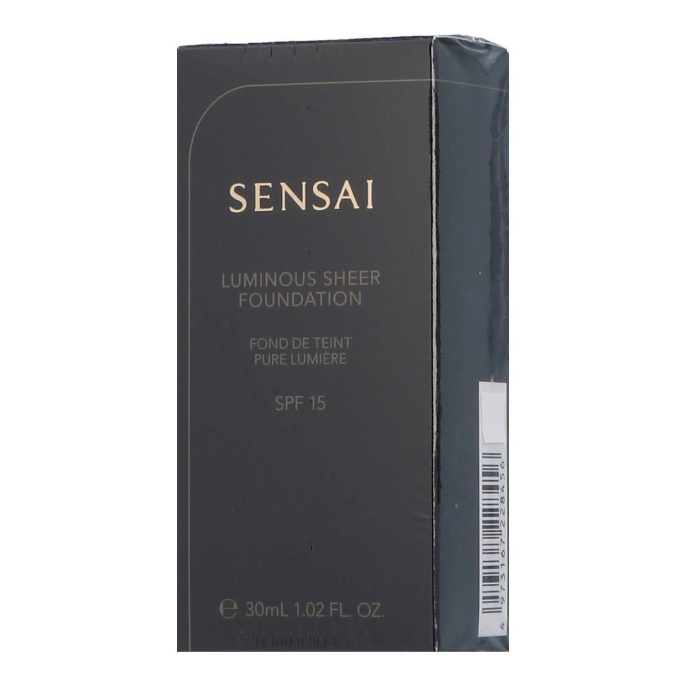 Black and gold packaging for Sensai Brightening Liquid Makeup SPF 15, labeled "Luminous Sheer Foundation," 30 ml, shade LS102, with a sleek design and clear product details.