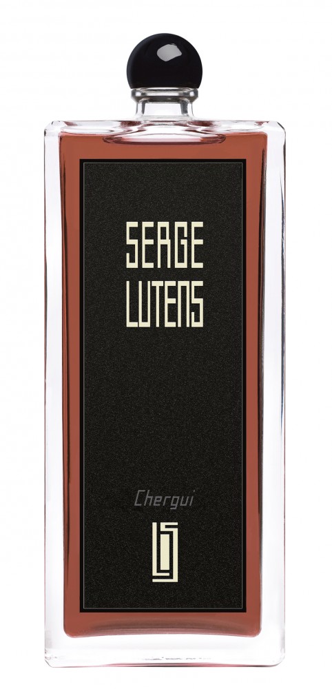 Clear glass bottle with a black label featuring gold text, topped with a round black cap, containing dark amber-colored perfume labeled "Chergui" by Serge Lutens.