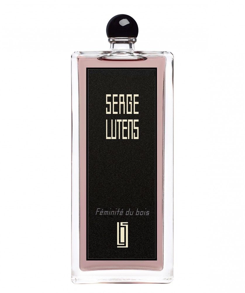 Clear glass bottle with a sleek rectangular shape, featuring a black label with gold text reading "SERGE LUTENS" and "Féminité du bois," topped with a round black cap.