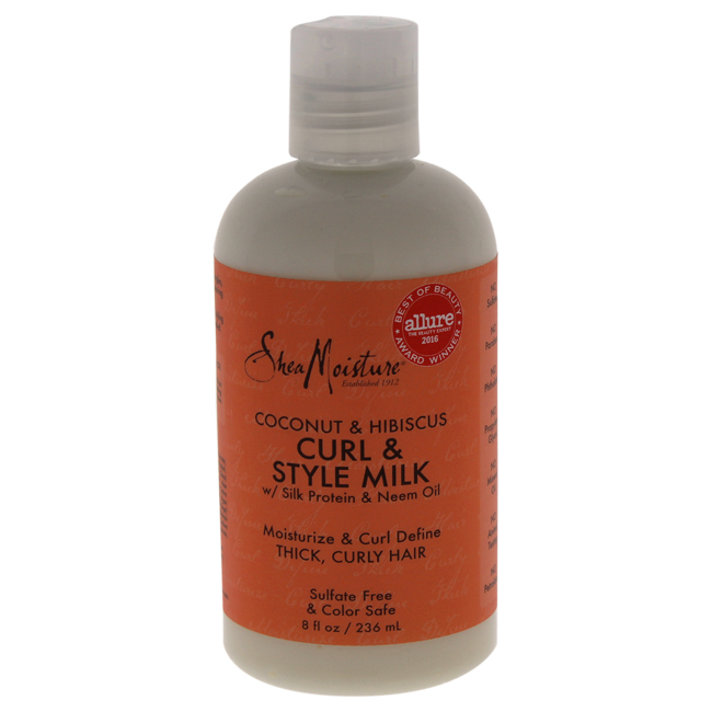 Clear plastic bottle with a white cap, labeled "Shea Moisture Curl & Style Milk" in orange and white text, featuring coconut and hibiscus graphics, 8 oz size, sulfate-free formula.