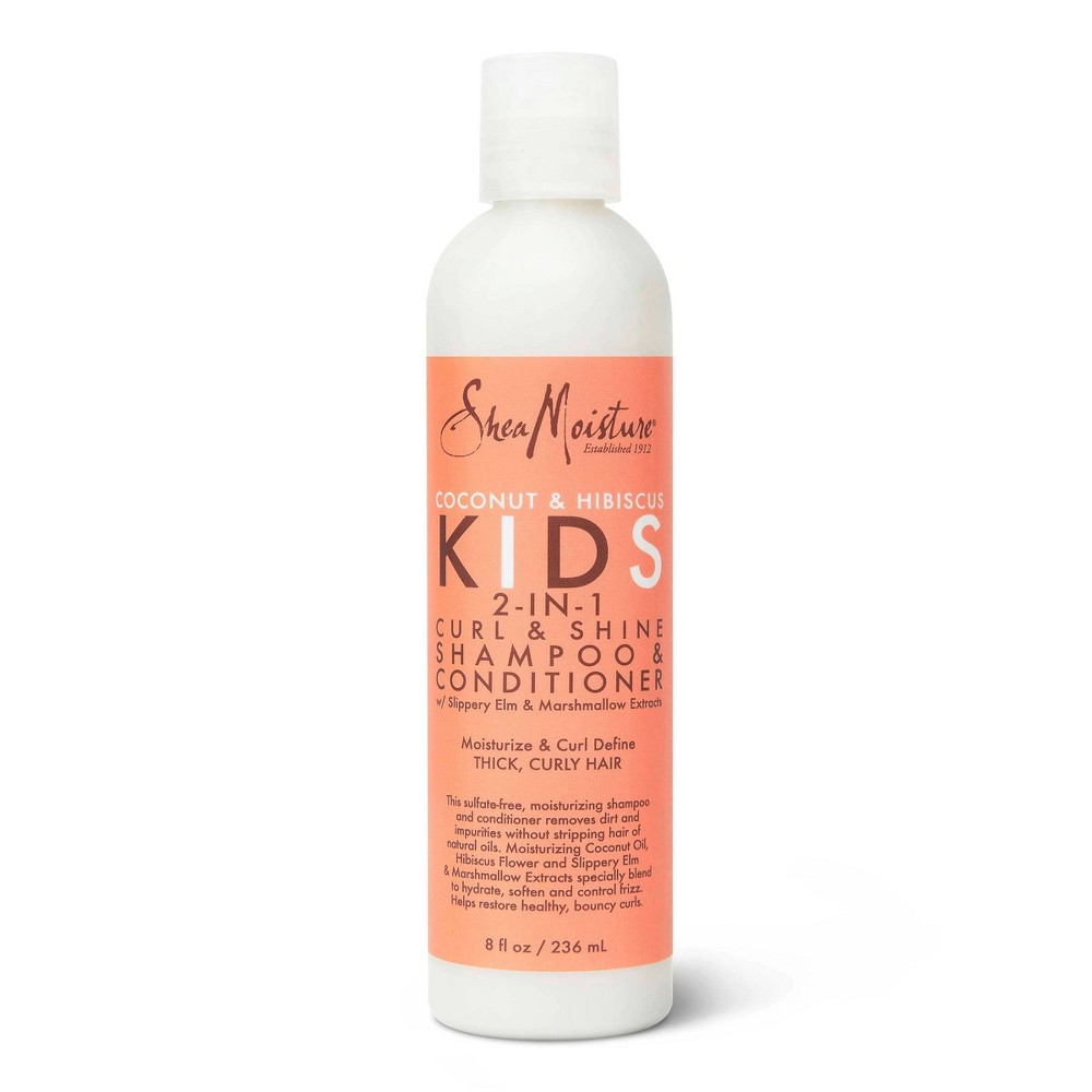 White bottle with a pump, featuring a bright orange label that reads "Shea Moisture Kids Coconut & Hibiscus 2-in-1 Shampoo and Conditioner," designed for thick, curly hair.
