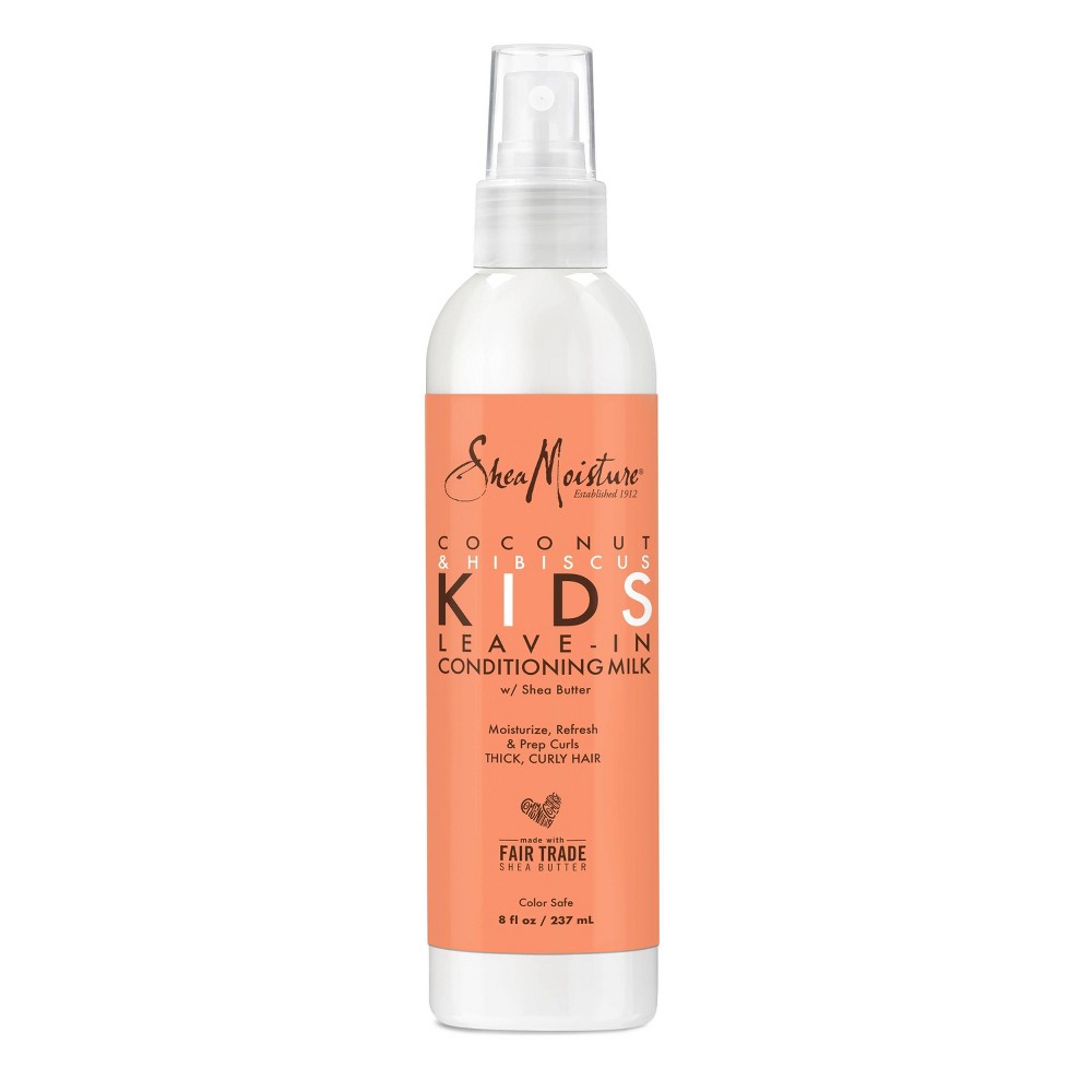 White spray bottle with an orange label, featuring "SheaMoisture" logo, product name "Kids Leave-in Conditioning Milk," and details for thick, curly hair, 8 Fl Oz.