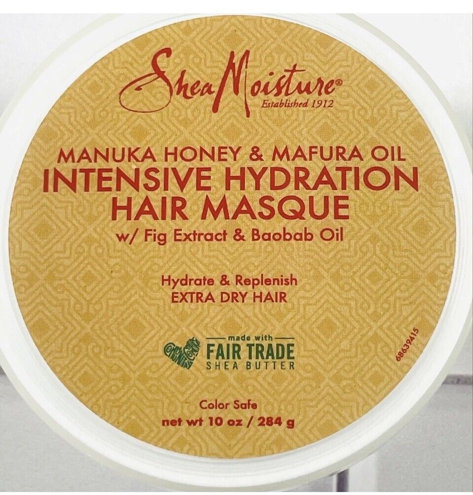 White circular container with a gold label, featuring "Shea Moisture" logo, product name "Intensive Hydration Hair Masque," and details about ingredients like Manuka honey and baobab oil.