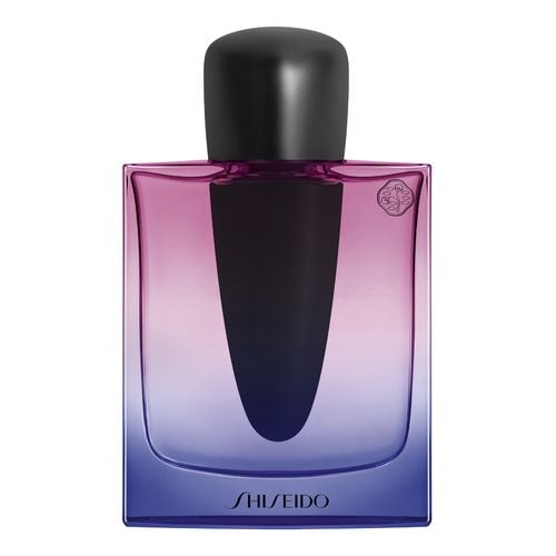 Shiseido Ginza Night Eau De Parfum in a sleek glass bottle featuring a gradient from deep purple to light lavender, topped with a glossy black cap.